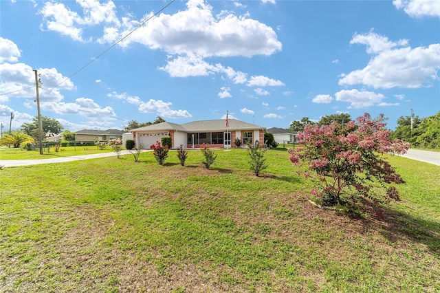 8850 SE 156th St, Summerfield, FL 34491 - ranch-style house featuring concrete driveway, a garage, and a front lawn
