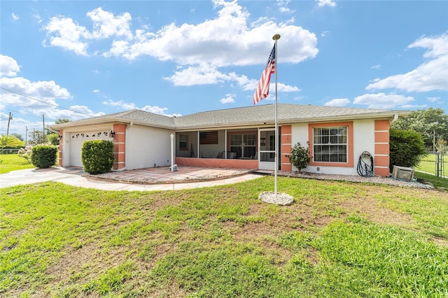 8850 SE 156th St, Summerfield, FL 34491 - view of front facade featuring stucco siding, a garage, driveway, and a sunroom