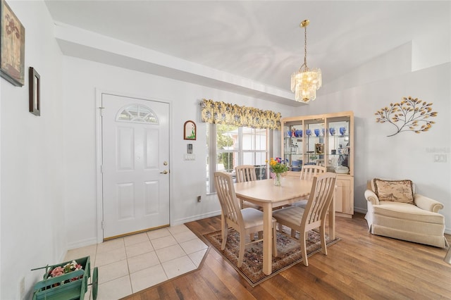 8850 SE 156th St, Summerfield, FL 34491 - dining space with a chandelier and light wood finished floors