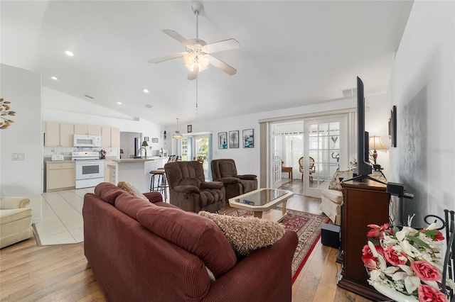 8850 SE 156th St, Summerfield, FL 34491 - living room featuring lofted ceiling, a ceiling fan, light wood-style floors, recessed lighting, and french doors