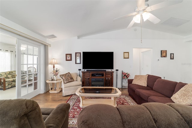 8850 SE 156th St, Summerfield, FL 34491 - living area with wood finished floors, lofted ceiling, and a ceiling fan
