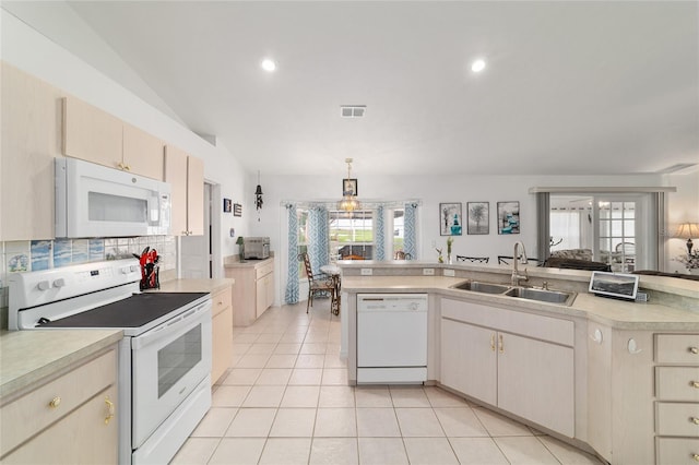 8850 SE 156th St, Summerfield, FL 34491 - kitchen featuring white appliances, light countertops, light tile patterned floors, decorative backsplash, and recessed lighting