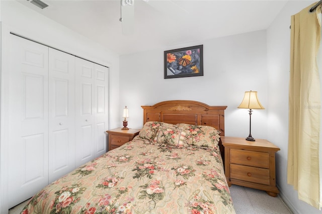 8850 SE 156th St, Summerfield, FL 34491 - bedroom featuring light carpet, a closet, and ceiling fan
