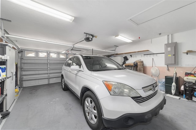 8850 SE 156th St, Summerfield, FL 34491 - garage featuring electric panel and a garage door opener