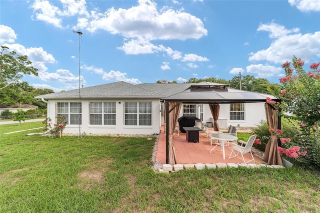 8850 SE 156th St, Summerfield, FL 34491 - rear view of property featuring a gazebo, a patio, a yard, and stucco siding