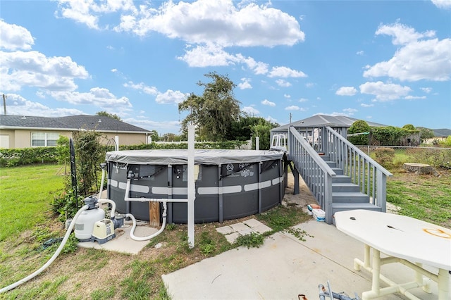 8850 SE 156th St, Summerfield, FL 34491 - view of swimming pool with stairway and a yard