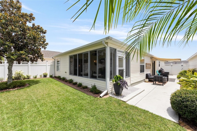579 Audrey Ln, The Villages, FL 32162 - back of house featuring a sunroom and a patio