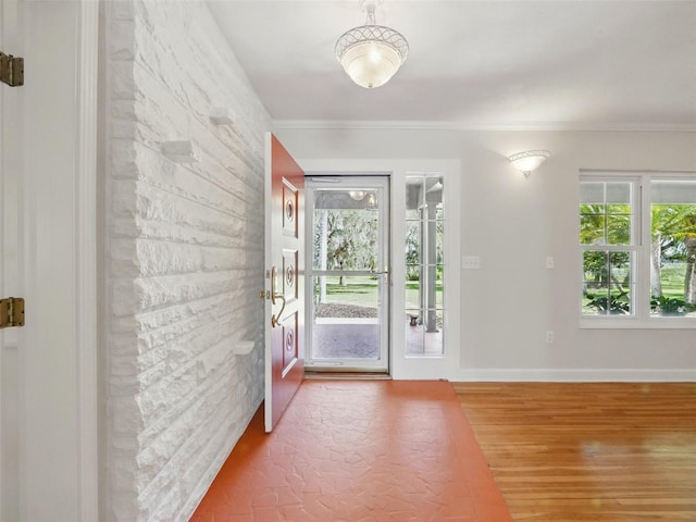 9269 Silver Lake Dr, Leesburg, FL 34788 - entrance foyer with wood finished floors, ornamental molding, and baseboards