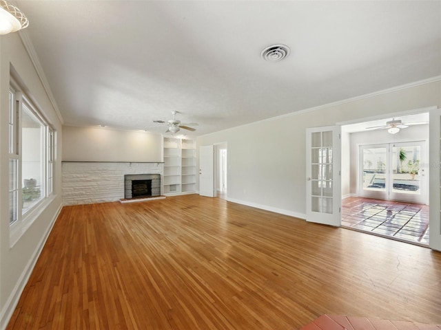 9269 Silver Lake Dr, Leesburg, FL 34788 - unfurnished living room with ceiling fan, plenty of natural light, baseboards, and ornamental molding