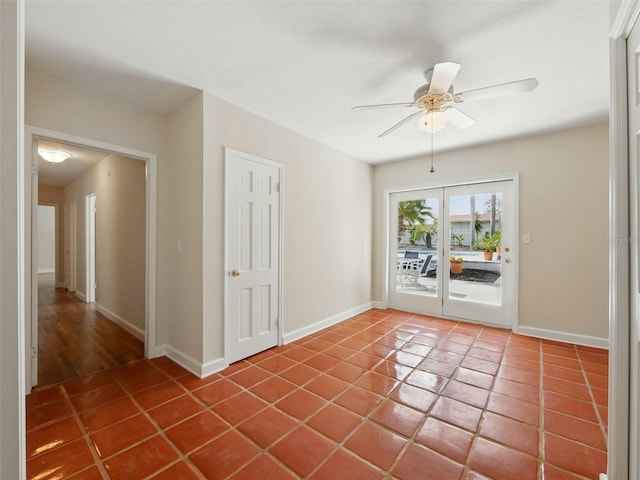 9269 Silver Lake Dr, Leesburg, FL 34788 - tiled empty room featuring baseboards and ceiling fan