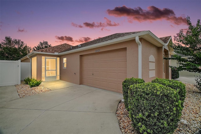 16827 SE 92nd Lance Ct, The Villages, FL 32162 - ranch-style home with stucco siding, an attached garage, and concrete driveway