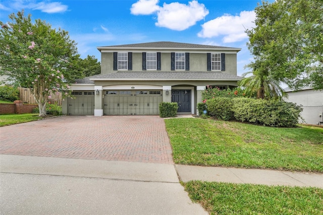 107 Wekiva Pointe Cir, Apopka, FL 32712 - traditional home featuring decorative driveway, stucco siding, and a front yard