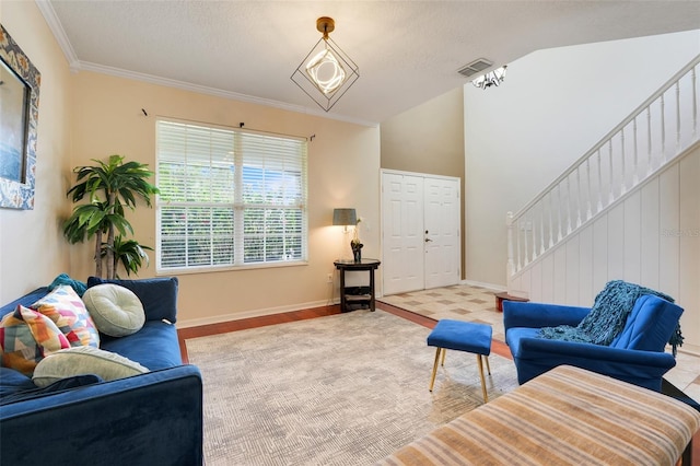 107 Wekiva Pointe Cir, Apopka, FL 32712 - living area featuring stairs, vaulted ceiling, ornamental molding, baseboards, and wood finished floors