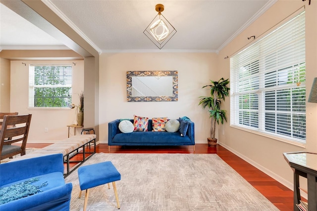107 Wekiva Pointe Cir, Apopka, FL 32712 - sitting room with wood finished floors, crown molding, and baseboards