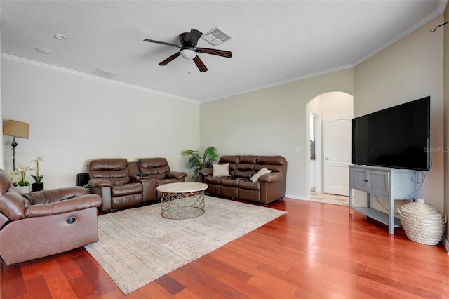 107 Wekiva Pointe Cir, Apopka, FL 32712 - living area with arched walkways, a ceiling fan, wood finished floors, and ornamental molding