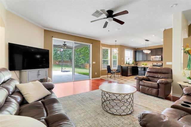 107 Wekiva Pointe Cir, Apopka, FL 32712 - living room with a ceiling fan, light wood finished floors, ornamental molding, baseboards, and recessed lighting