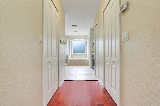 107 Wekiva Pointe Cir, Apopka, FL 32712 - hall with wood finished floors and a textured wall