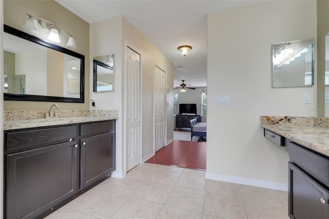 107 Wekiva Pointe Cir, Apopka, FL 32712 - bathroom featuring ceiling fan, two vanities, tile patterned flooring, and baseboards
