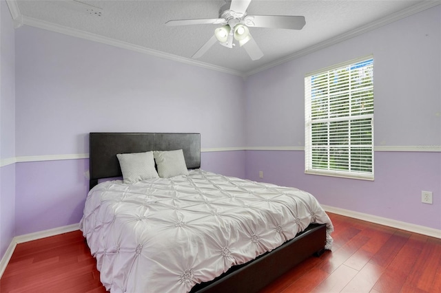 107 Wekiva Pointe Cir, Apopka, FL 32712 - bedroom featuring wood finished floors, baseboards, ceiling fan, a textured ceiling, and ornamental molding