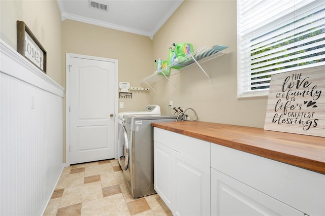 107 Wekiva Pointe Cir, Apopka, FL 32712 - laundry area with washing machine and dryer, crown molding, stone finish floors, and baseboards