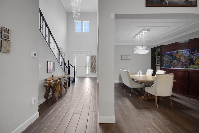 14501 Wabasso Loop, Winter Garden, FL 34787 - dining room featuring a chandelier, healthy amount of natural light, stairway, baseboards, and crown molding