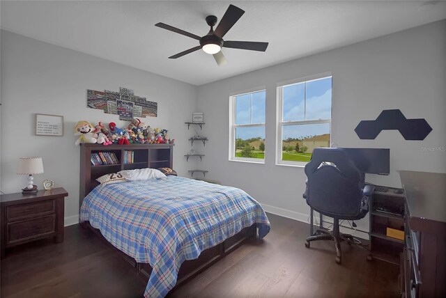 14501 Wabasso Loop, Winter Garden, FL 34787 - bedroom with baseboards, wood finished floors, and ceiling fan