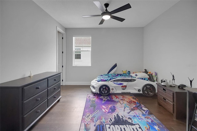 14501 Wabasso Loop, Winter Garden, FL 34787 - bedroom with a ceiling fan, baseboards, and dark wood-style floors