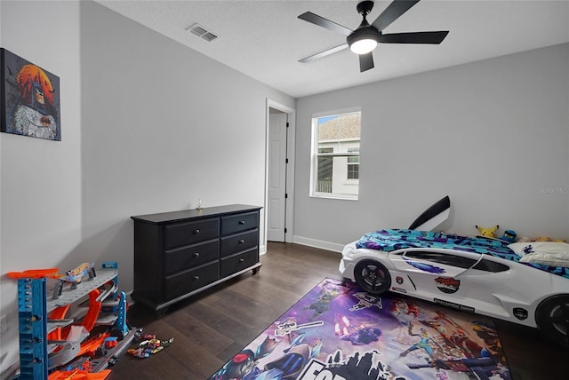14501 Wabasso Loop, Winter Garden, FL 34787 - bedroom featuring dark wood-style floors, ceiling fan, and baseboards