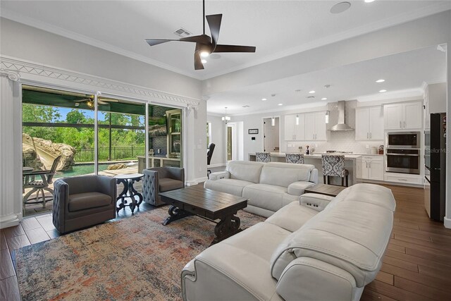 14501 Wabasso Loop, Winter Garden, FL 34787 - living area featuring a ceiling fan, ornamental molding, dark wood-type flooring, recessed lighting, and baseboards