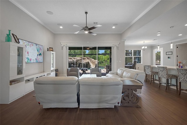 14501 Wabasso Loop, Winter Garden, FL 34787 - living room with healthy amount of natural light, a ceiling fan, dark wood-style floors, ornamental molding, and recessed lighting