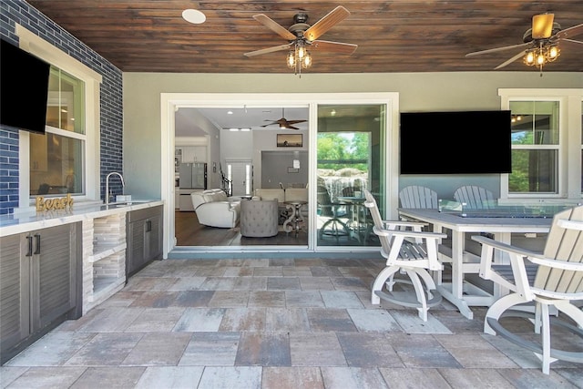 14501 Wabasso Loop, Winter Garden, FL 34787 - view of patio / terrace featuring a ceiling fan, a sink, and outdoor dining area