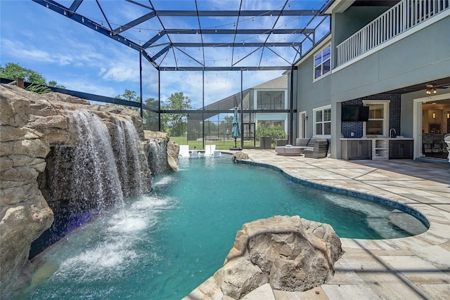 14501 Wabasso Loop, Winter Garden, FL 34787 - outdoor pool with area for grilling, a patio, glass enclosure, and a ceiling fan