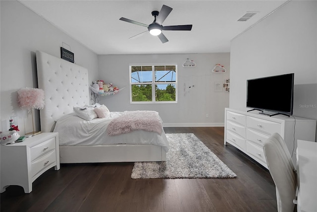 14501 Wabasso Loop, Winter Garden, FL 34787 - bedroom featuring dark wood-style floors and a ceiling fan