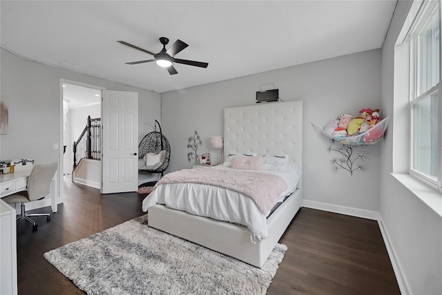 14501 Wabasso Loop, Winter Garden, FL 34787 - bedroom with dark wood finished floors and a ceiling fan