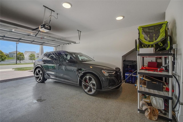 14501 Wabasso Loop, Winter Garden, FL 34787 - garage with a garage door opener and recessed lighting