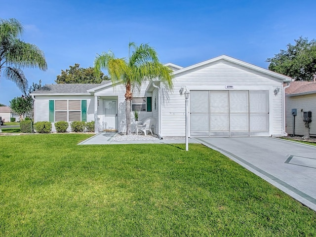 2799 Privada Dr, The Villages, FL 32162 - ranch-style home with an attached garage, driveway, and a front lawn