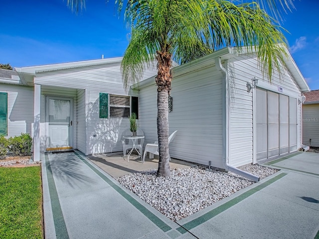 2799 Privada Dr, The Villages, FL 32162 - view of front of property featuring an attached garage