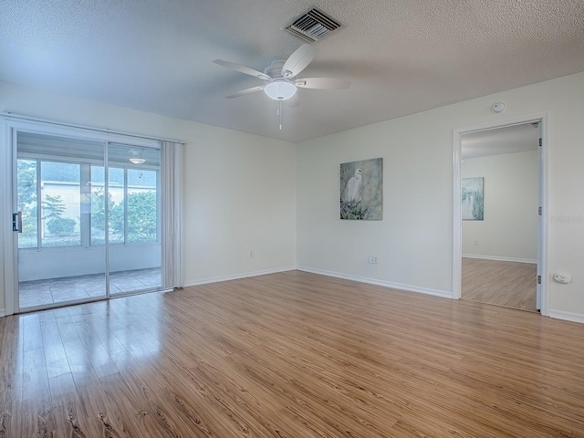 2799 Privada Dr, The Villages, FL 32162 - spare room featuring wood finished floors, a ceiling fan, and a smoke detector