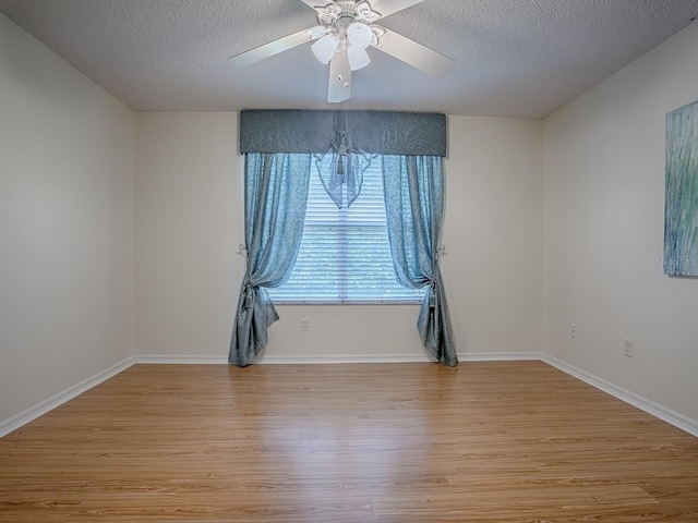2799 Privada Dr, The Villages, FL 32162 - empty room featuring light wood-style floors, ceiling fan, and a textured ceiling
