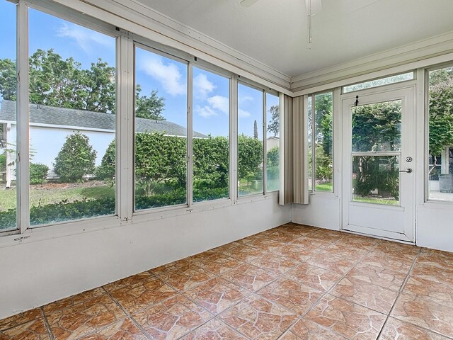 2799 Privada Dr, The Villages, FL 32162 - unfurnished sunroom with crown molding