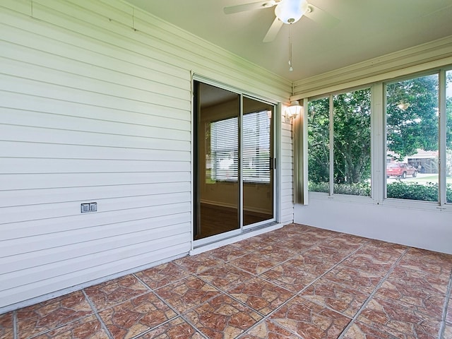 2799 Privada Dr, The Villages, FL 32162 - unfurnished sunroom featuring a ceiling fan