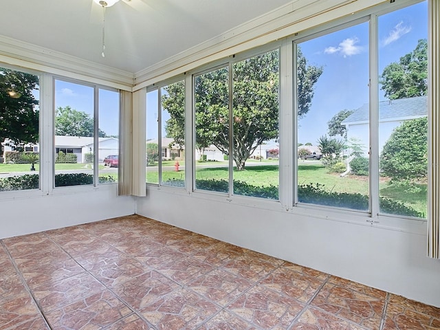 2799 Privada Dr, The Villages, FL 32162 - unfurnished sunroom featuring ornamental molding
