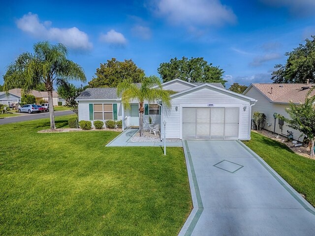 2799 Privada Dr, The Villages, FL 32162 - ranch-style home featuring concrete driveway, a front yard, and an attached garage