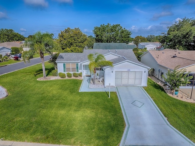 2799 Privada Dr, The Villages, FL 32162 - single story home featuring a garage, driveway, and a front yard