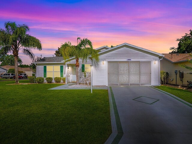 2799 Privada Dr, The Villages, FL 32162 - single story home with driveway, a front lawn, and an attached garage