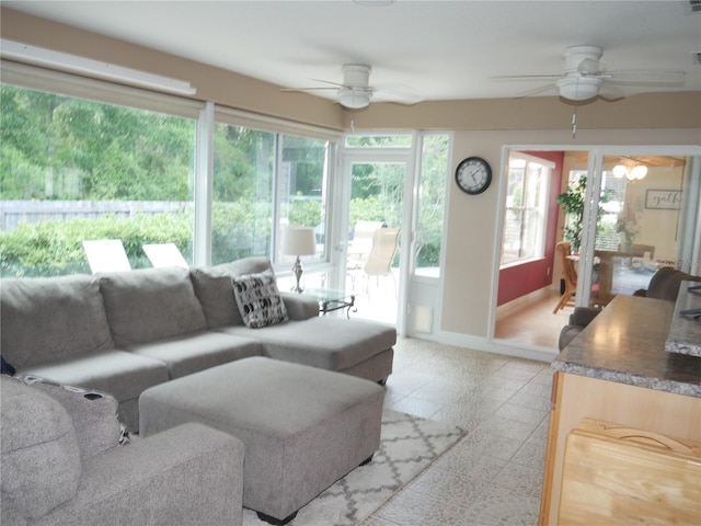 8377 SE 177th Bartram Loop, The Villages, FL 32162 - living area with a ceiling fan and baseboards