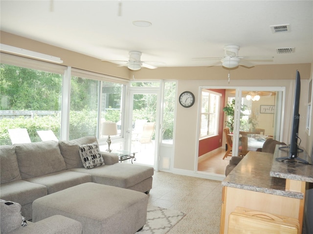 8377 SE 177th Bartram Loop, The Villages, FL 32162 - living area with ceiling fan and baseboards