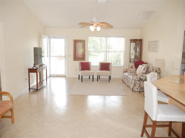 8377 SE 177th Bartram Loop, The Villages, FL 32162 - living room featuring healthy amount of natural light, ceiling fan, light tile patterned floors, and baseboards