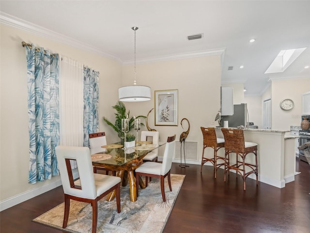 17324 SE 82nd Pecan Ter, The Villages, FL 32162 - dining space featuring ornamental molding, a skylight, wood finished floors, baseboards, and recessed lighting