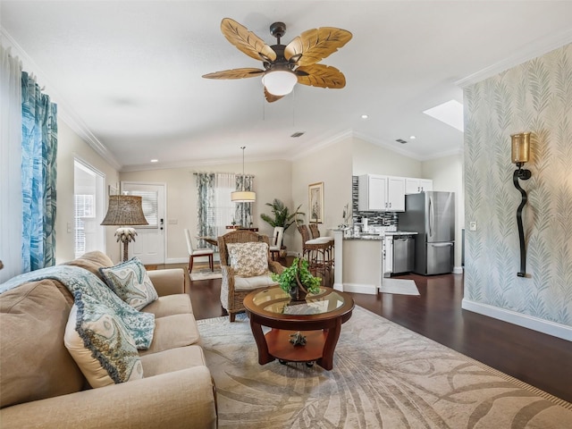 17324 SE 82nd Pecan Ter, The Villages, FL 32162 - living room with dark wood-style floors, baseboards, ceiling fan, recessed lighting, and crown molding